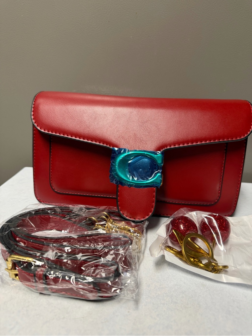 Red Leather Shoulder Bag with Decorative Hardware